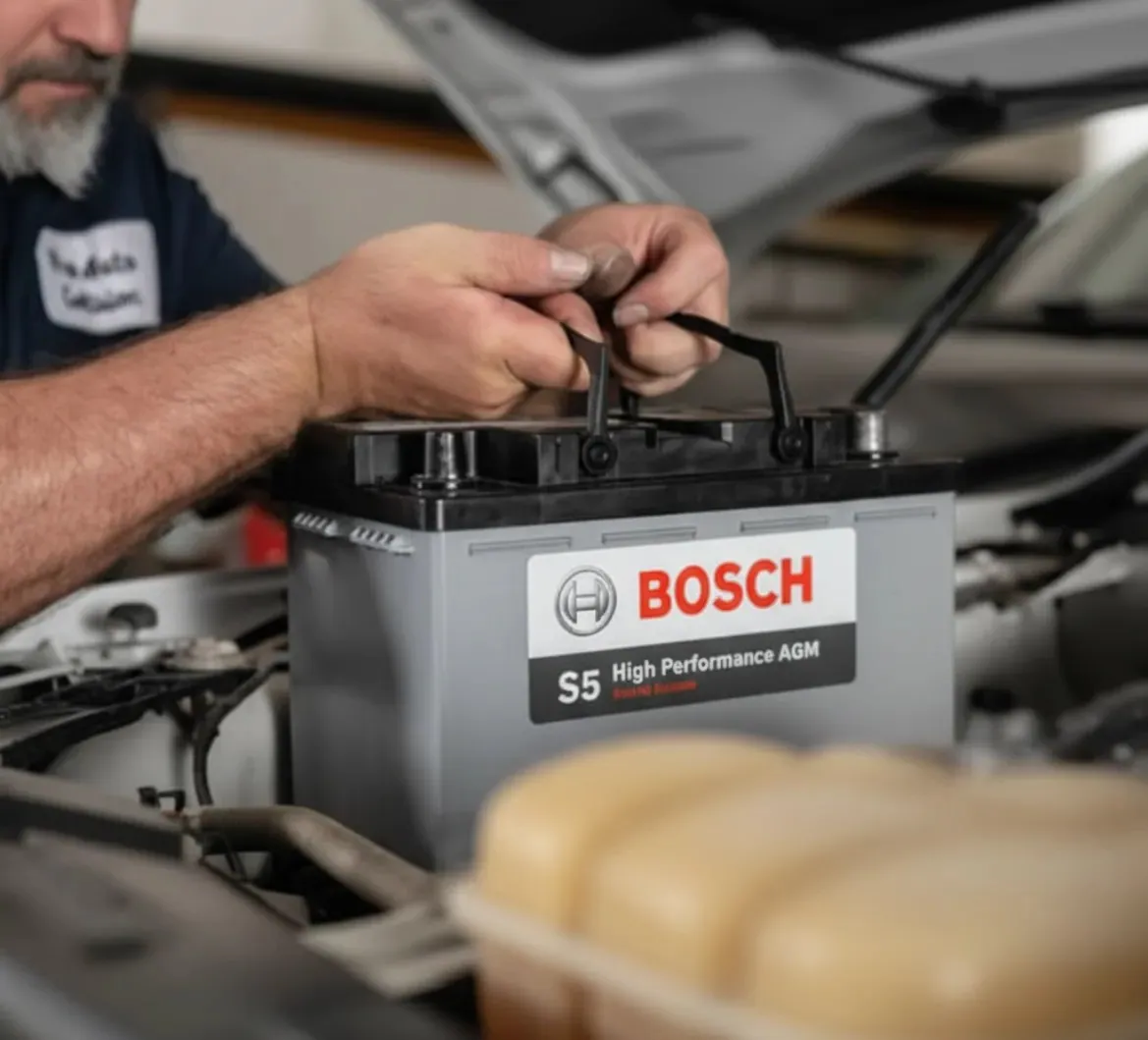 The way we work Technician fitting a Bosch S5 battery
